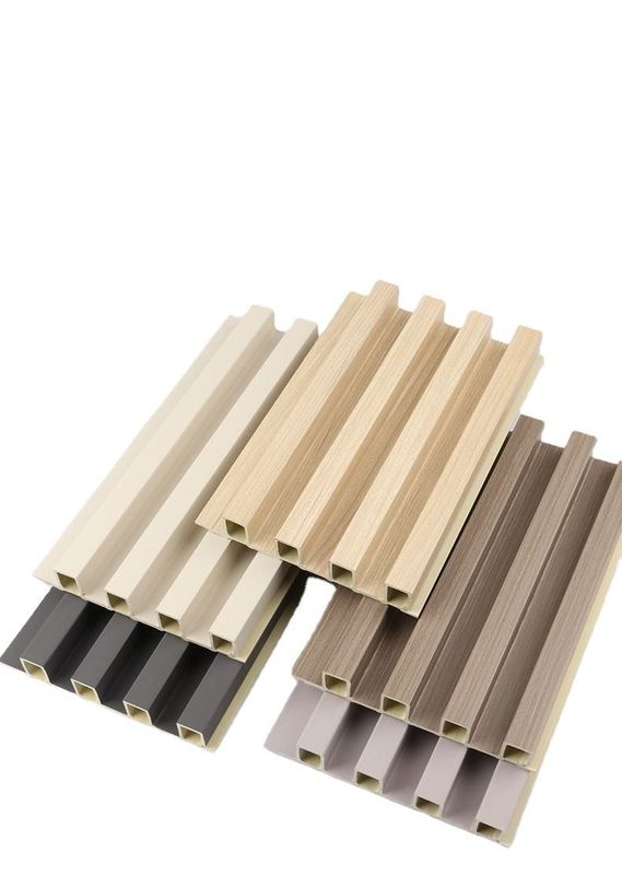 सस्ती कीमत सजावटी घर निर्माण सामग्री किफायती लकड़ी अनाज पीवीसी Wpc दीवार पैनल