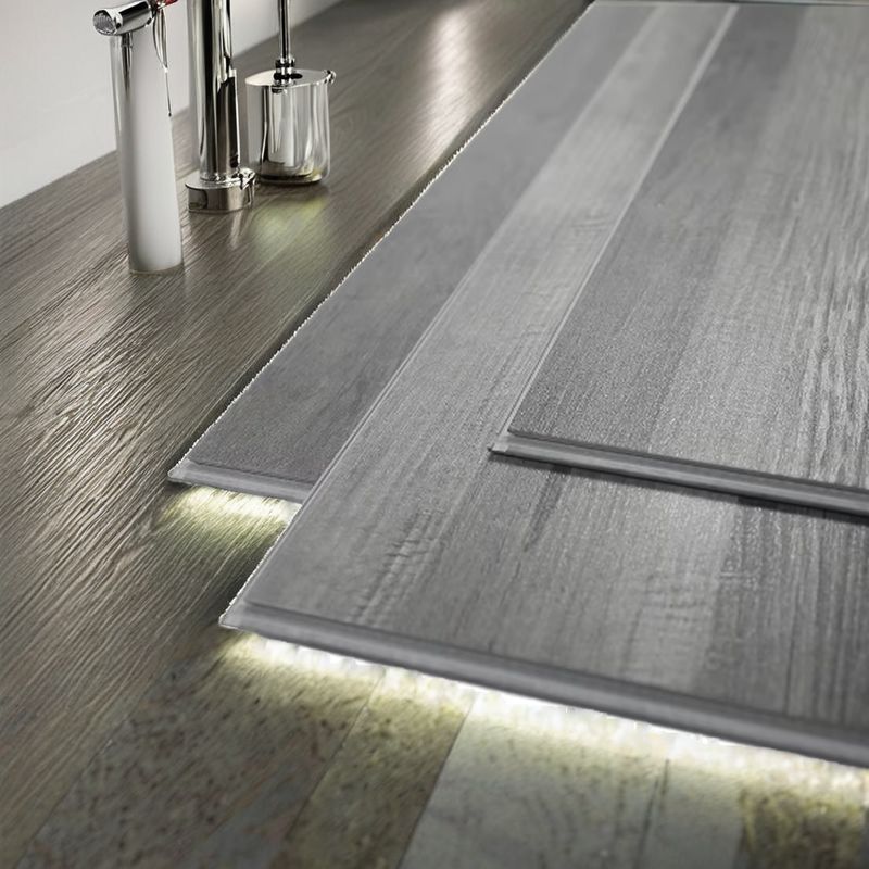 आधुनिक शैली एसपीसी विनाइल फर्श अच्छी डिजाइन प्लास्टिक 4.5 मिमी 5.5 मिमी 6.5 मिमी इनडोर उपयोग सरल बनावट के साथ विरोधी फिसलन पीवीसी